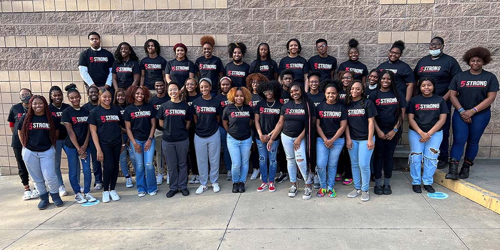 Group of students wearing 5 Strong t-shirts