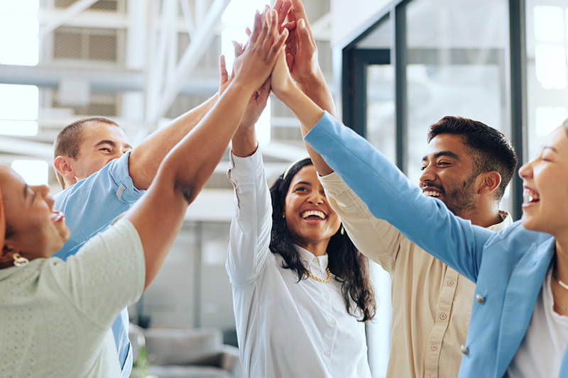 Group of office professionals celebrating